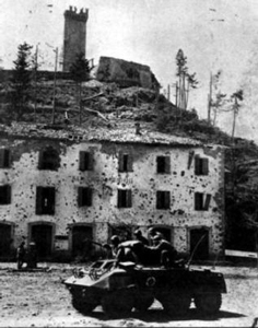 A Brazilian M8 advances into a village