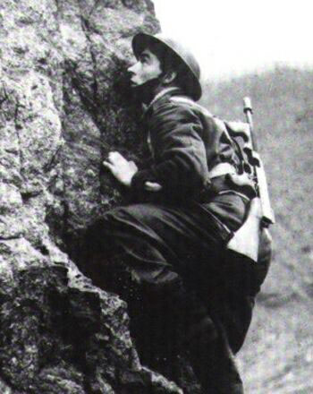 Commando climbing cliff Commando climbing cliff