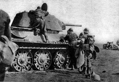 Romanian Infantry check out a T-34 Romanian Infantry check out a T-34