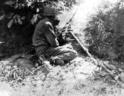 A .50cal machine-gun sets up in the bocage A .50cal machine-gun sets up in the bocage