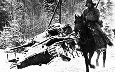 Soviet cavalryman pases an abandoned Panzer III Soviet cavalryman pases an abandoned Panzer III