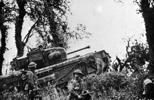 Churchill VI advancing across the bocage Churchill VI advancing across the bocage